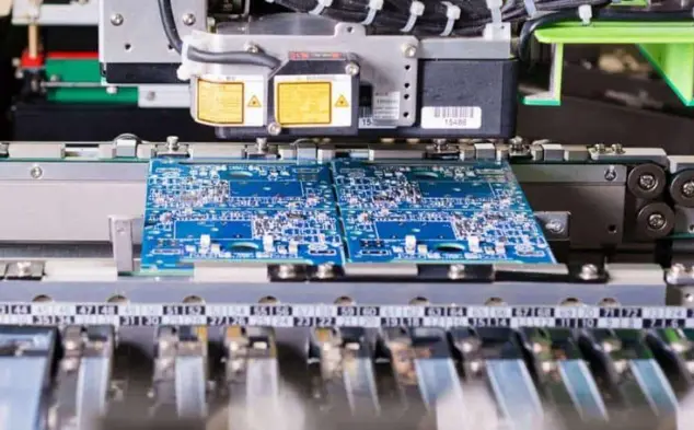 SMT PCB assembly machine placing electronic components onto printed circuit boards